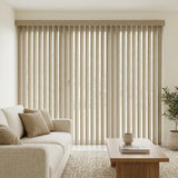 A look at Beige (Vail Curved Oat) 3 1/2 Inch Signature Pvc Vertical Blinds inside a serene living room, combining practical light filtering with a structured modern look.