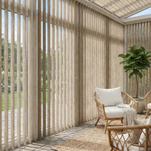 Load image into Gallery viewer, Styling a peaceful living space with Beige (Wanderlust Desert) Signature Pvc Vertical Blinds, filtering incoming daylight effectively across wide glass surfaces.
