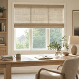 Transform your space with Wicker Look Woven Cordless Shades, effortlessly filtering soft beige light into this serene room featuring a plush armchair and reading nook.