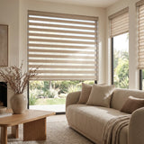 Warm beige tones complement this serene scene with Zebra Light Filtering Roller Shades and a peaceful living space