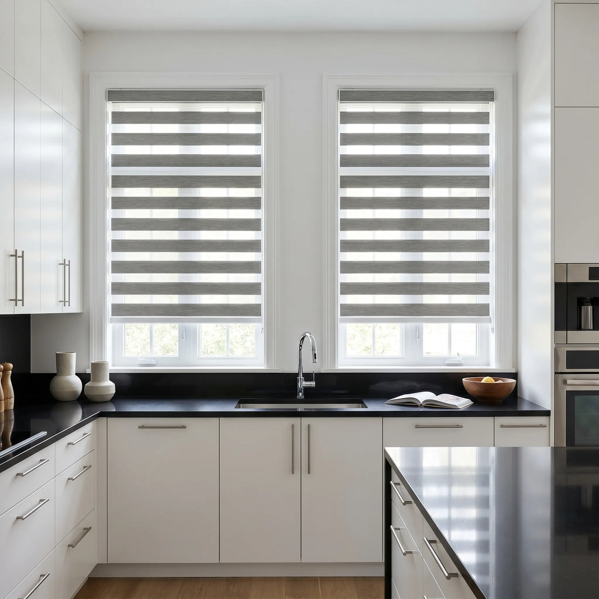 Zebra Light Filtering Roller Shades add a striking touch to this modern kitchen with black and white decor, blocking out harsh light while maintaining natural brightness