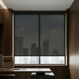Executive office view of a black luxury ProGrade solar shade, highlighting its premium aesthetic and functionality.
