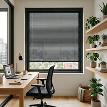 Load image into Gallery viewer, Custom window treatments: Black (Black Satin) Classic Cordless 6g Aluminum Mini Blinds shown in a cozy study, managing sunlight effectively with easy-to-tilt aluminum slats.
