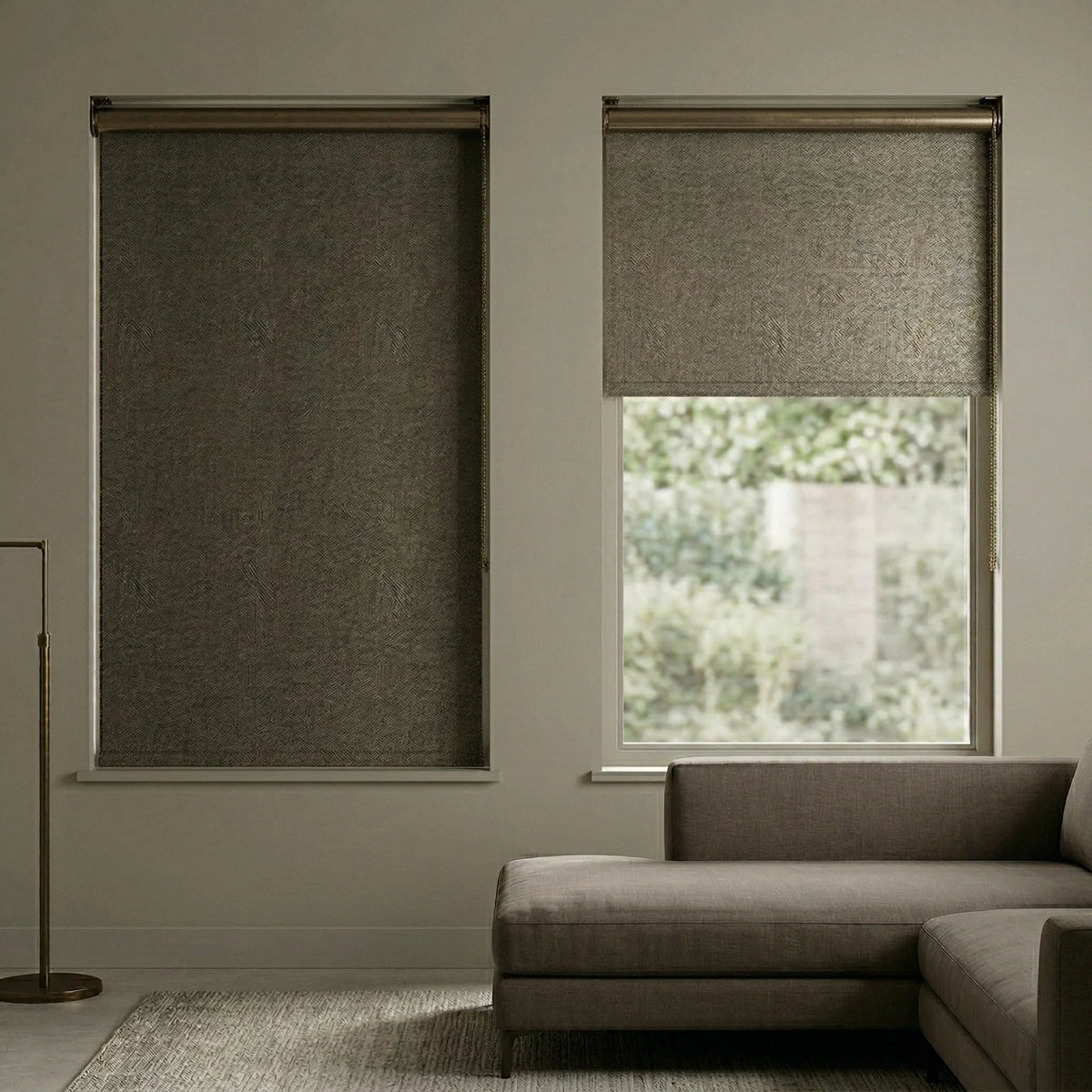 Bronze-brown Jerusalem Bronze Luxe room darkening shades in a stylish living room, offering a textured and organic appearance.