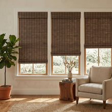 Load image into Gallery viewer, Clove Natural Bamboo Shades in brown on living room windows
