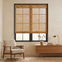 Load image into Gallery viewer, Copper Natural Bamboo Shade in warm brown on a reading nook window
