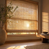 Immerse yourself in warmth with Cordless Woven Wood Shades, perfectly complementing this inviting room where sunlight dances through brown bamboo blinds.