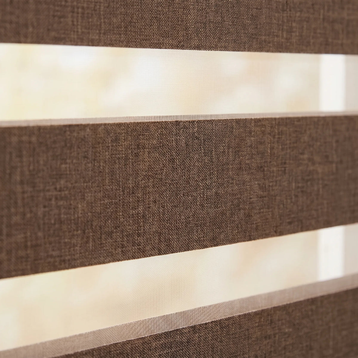 Transform your space with Zebra Room Darkening Roller Shades' earthy brown stripes, perfect for traditional or vintage settings.