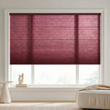 Load image into Gallery viewer, Custom window treatments: Burgundy (Bordeaux) 7 16 Inch Double Cell Light Filtering Shades shown in a modern living space, beautifully diffusing natural sunlight.
