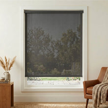 Load image into Gallery viewer, Premier 5% Solar Screen Roller Shade adds modern sophistication to this cozy living room with charcoal accents and UV protected natural light

