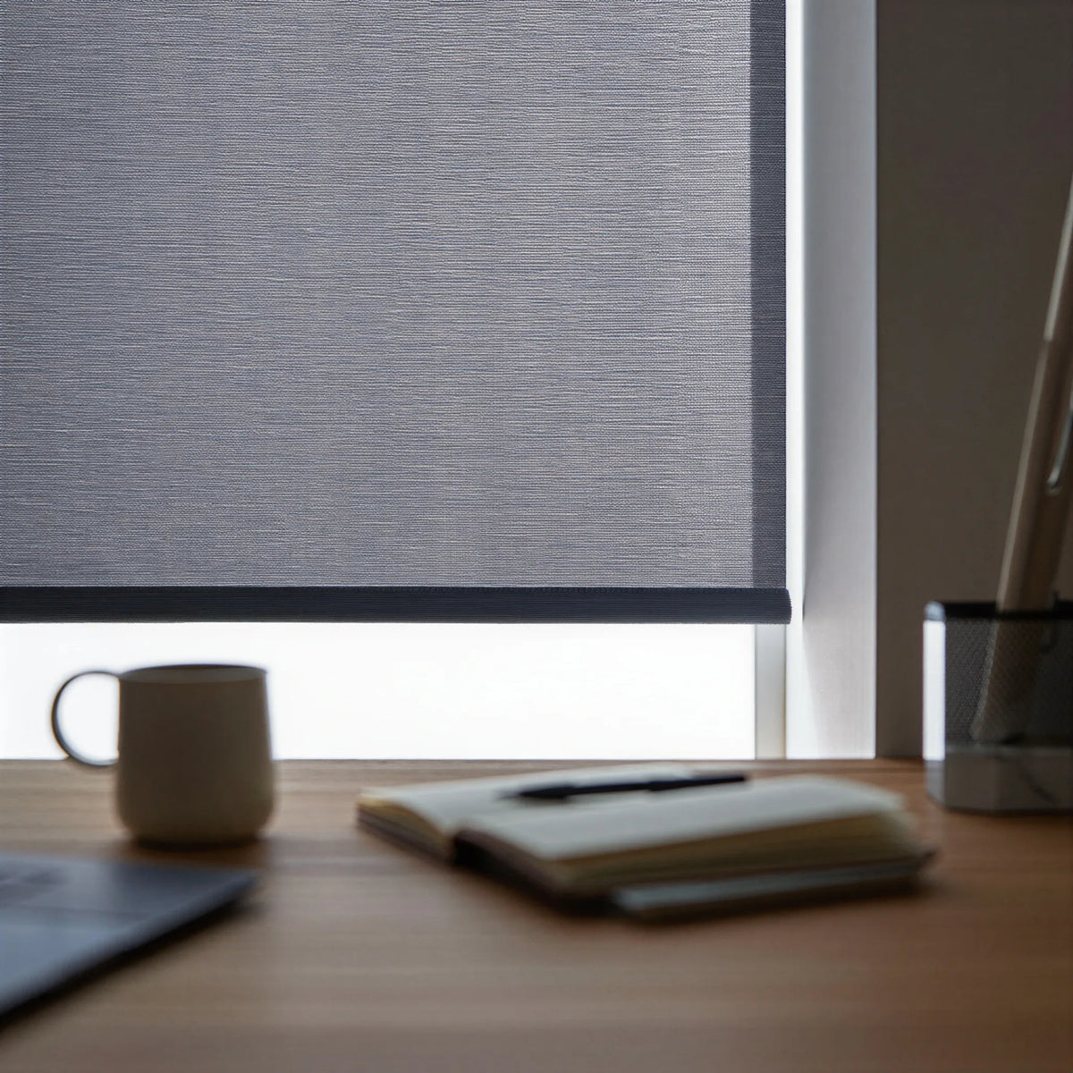 Add contemporary flair with Contemporary Fabric Light Filtering Roller Shades' charcoal gray patterned fabric, perfect for home offices or creative spaces.