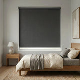 Charcoal black Modern Fabric Blackout Roller Shades add a touch of elegance to this serene modern bedroom, blocking out light and promoting a restful ambiance.