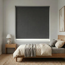 Load image into Gallery viewer, Charcoal black Modern Fabric Blackout Roller Shades add a touch of elegance to this serene modern bedroom, blocking out light and promoting a restful ambiance.
