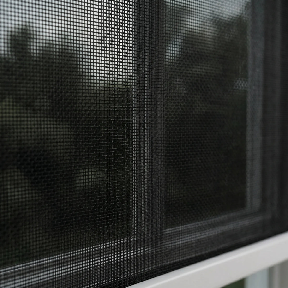 Macro Shot of Premier 1% Solar Screen Roller Shade showing the complex weave of fabric providing light blocking and transparency effect at the same time.