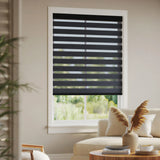 Zebra Room Darkening Roller Shades in charcoal bring warmth and elegance to this modern living room with natural light filtering through.