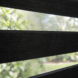 Enhance modern spaces with Zebra Solar Roller Shades, filtering in charcoal-toned light while maintaining privacy and UV protection.