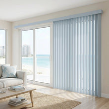 Load image into Gallery viewer, Custom window treatments: Cobalt Classic Curved Pvc Smooth Vertical Blinds shown in a serene living room, perfect for covering sliding glass doors or large windows.
