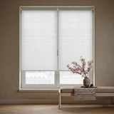 A modern living room featuring Creamy White (Cool White) 3 8 Inch Budget Single Cell Light Filtering Cordless Shades, reducing screen glare while welcoming natural sunshine.