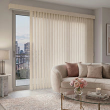 Load image into Gallery viewer, Custom window treatments: Cream (Alyssa Buttermilk) Premier Pvc Vertical Blinds shown in a serene living space, filtering incoming daylight effectively across wide glass surfaces.
