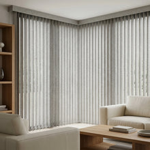 Load image into Gallery viewer, Natural sunlight hits the Cream (Cay Antique Silver) 3 1/2 Inch Signature Pvc Vertical Blinds in this inviting living room, ideal for expansive windows requiring versatile light management.
