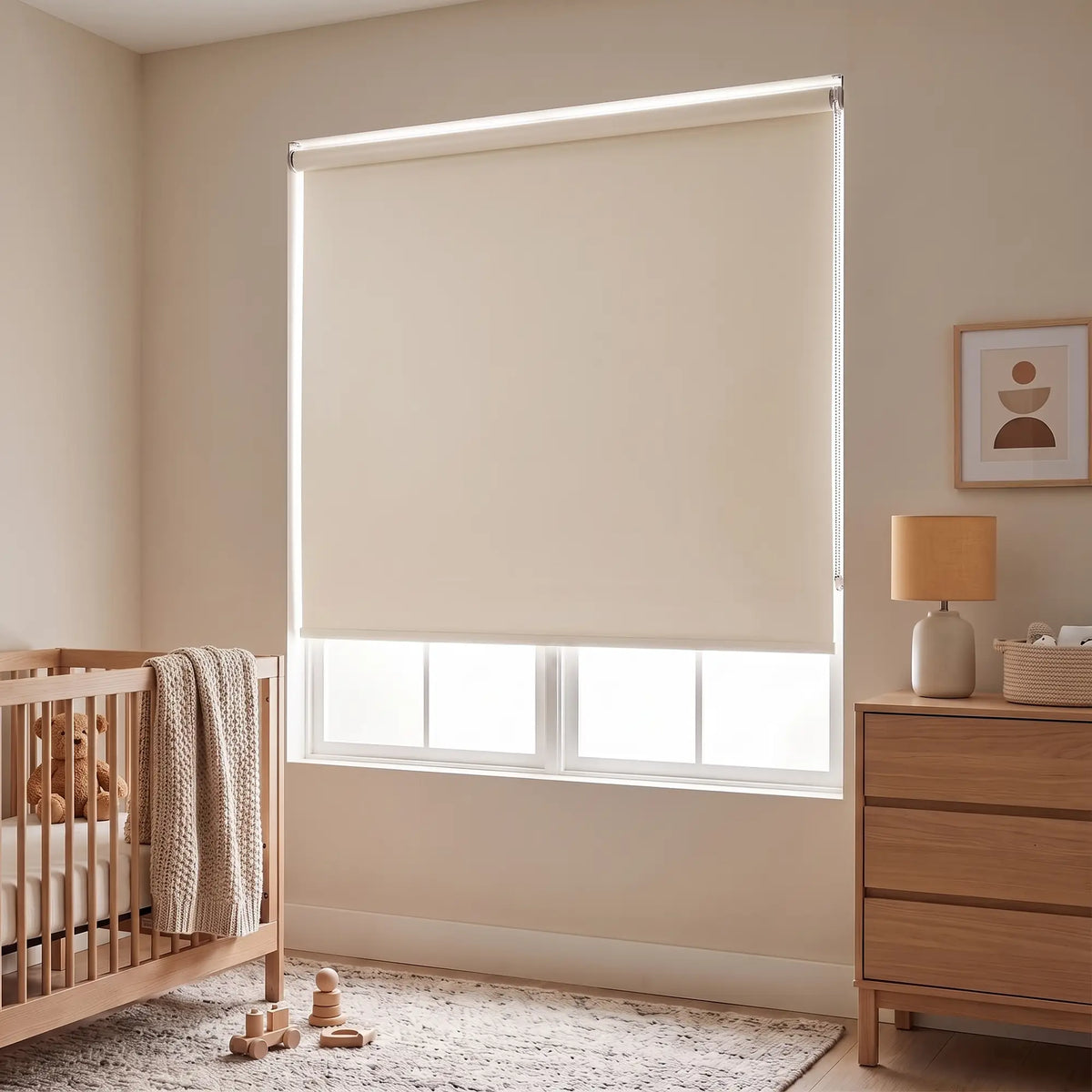 Cream Classic Blackout Vinyl Roller Shade blocking daylight in a nursery beside a wood crib