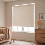 Cream Classic Blackout Vinyl Roller Shade blocking daylight in a nursery beside a wood crib