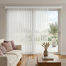 Load image into Gallery viewer, Cream (Costa Rica White) Premier Pvc Vertical Blinds installed in a serene living room, delivering sleek functionality and room-darkening capabilities.
