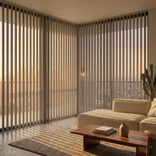 Load image into Gallery viewer, Interior view of a serene living room styled with Cream Classic Curved Pvc Smooth Vertical Blinds, ideal for expansive windows requiring versatile light management.
