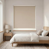 Classic Blackout Vinyl Roller Shades in a cozy bedroom setting, providing a neutral cream beige backdrop and blocking out light for a peaceful atmosphere.
