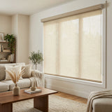 Cream-colored Ivory Luxe natural light filtering shades styled in a modern living room with neutral furnishings.