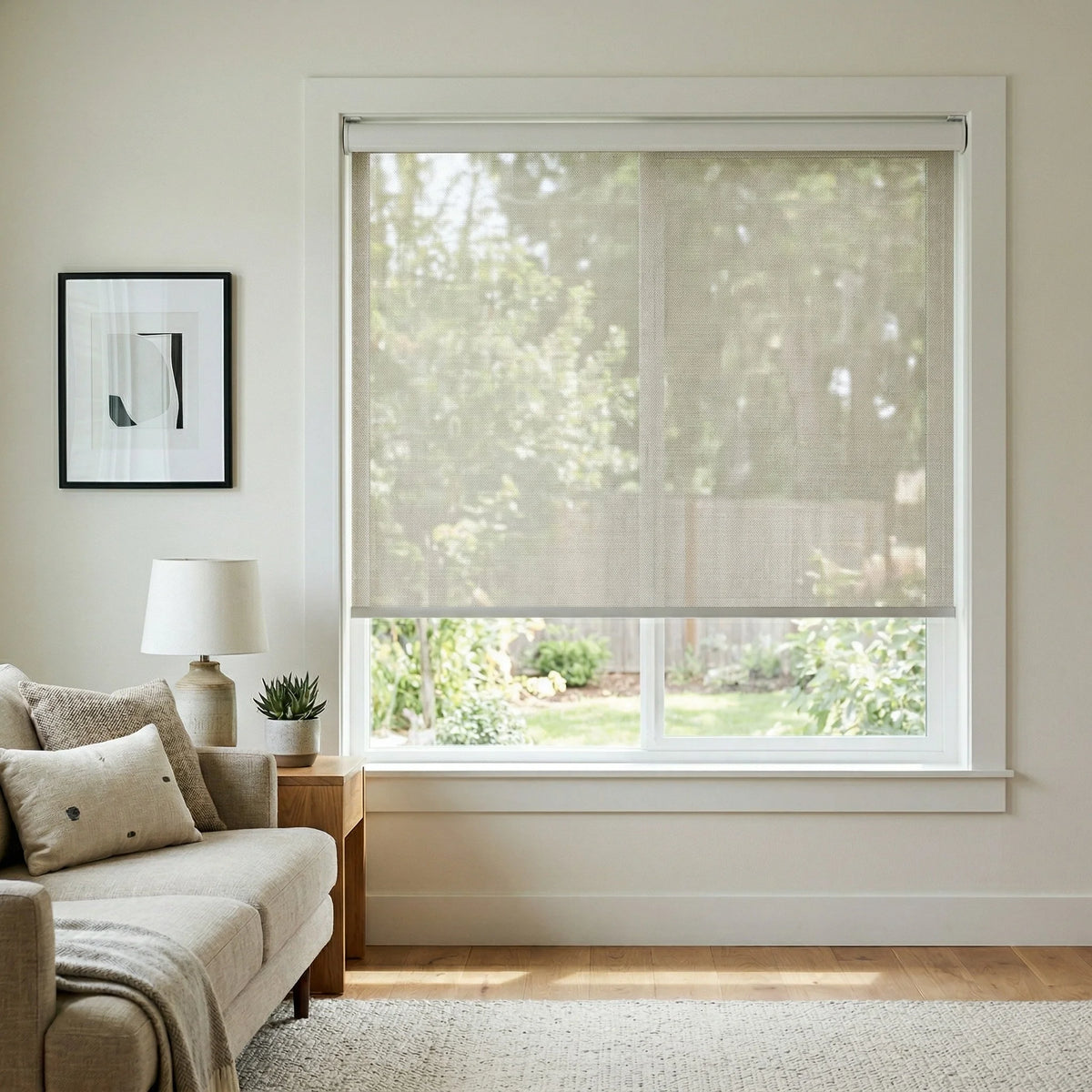 Front-facing view of a cream-colored Natural solar shade with 14 percent openness, providing light filtering and UV protection in a bright sitting area.