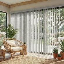 Load image into Gallery viewer, Cream (Perforated Flat Gray) Premier Pvc Vertical Blinds installed in a inviting living space, delivering sleek functionality and room-darkening capabilities.
