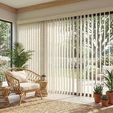 Load image into Gallery viewer, Wide view of Cream (Perforated Flat Ivory) Premier Pvc Vertical Blinds complementing a inviting living space, allowing adjustable natural light through durable PVC vanes.
