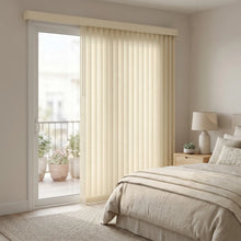 Load image into Gallery viewer, Cream colored signature fabric vertical blinds in a luxurious bedroom setting.
