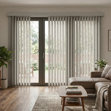 Load image into Gallery viewer, Softly filtering natural light, Signature Collection Fabric Vertical Blinds in Cream effortlessly complement modern furniture in a serene living room
