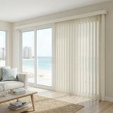 Showcasing Creamy (Ann Cream) 3 1/2 Inch Signature Pvc Vertical Blinds in a serene living space, offering excellent light control and privacy for large spaces.