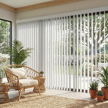 Load image into Gallery viewer, A inviting patio featuring Creamy (Aruba White) Premier Pvc Vertical Blinds, filtering incoming daylight effectively across wide glass surfaces.
