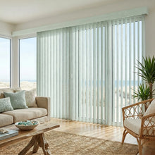 Load image into Gallery viewer, Creamy (Belize Rocky Beach) Signature Pvc Vertical Blinds installed in a warm living space, delivering sleek functionality and room-darkening capabilities.
