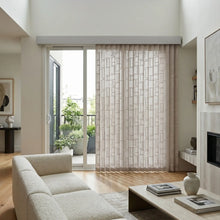 Load image into Gallery viewer, Signature Collection Fabric Vertical Blinds in creamy white harmonize with beige sofa, adding warmth and serenity to this inviting living room retreat.
