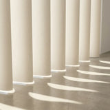 Macro shot of S shape pvc vertical shades showing the elegant curve bending light.
