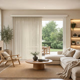 View of a warm living room with Creamy Signature Pvc Vertical Blinds, managing sunlight and privacy with smooth vertical operation.