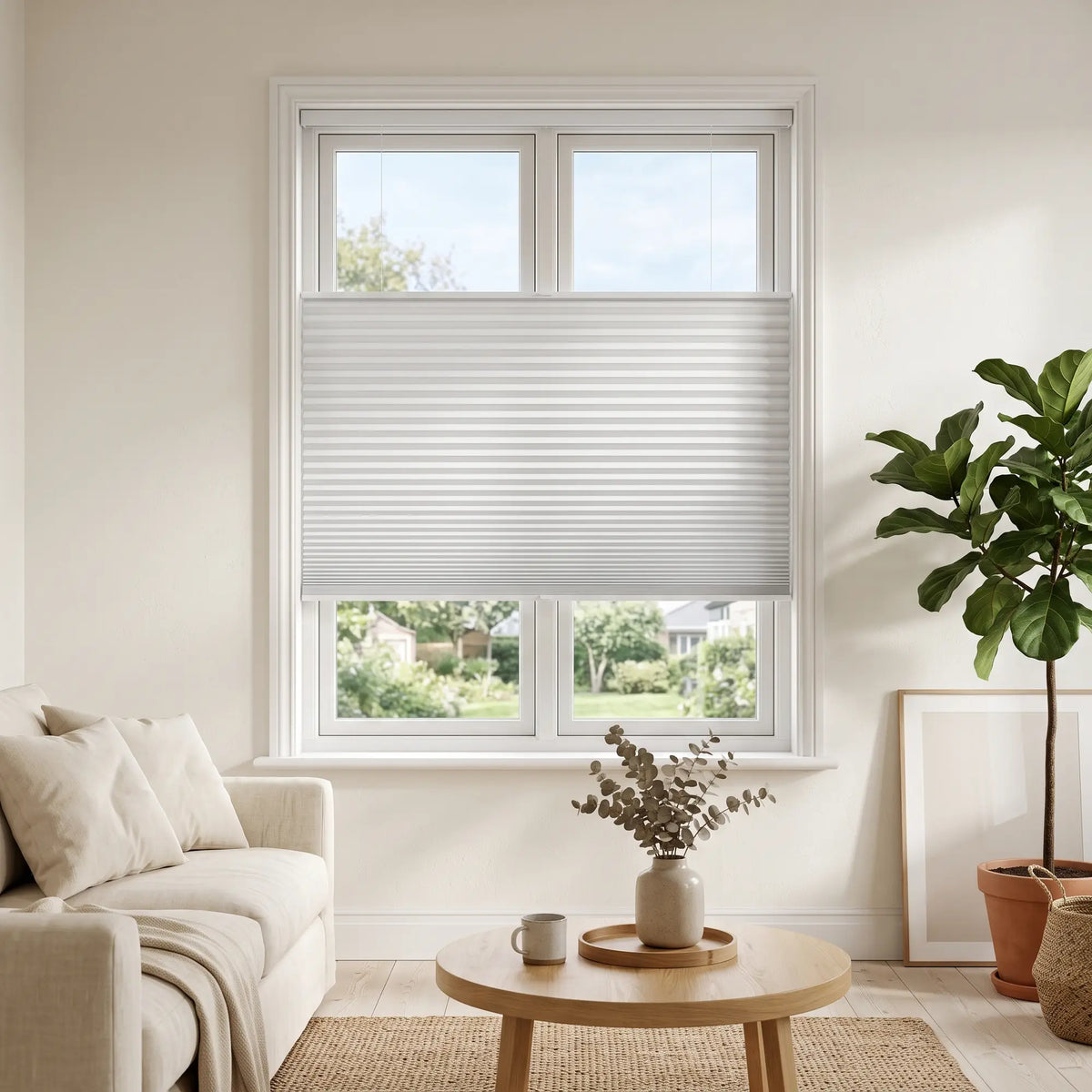 Simplistic Cordless Tdbu Pleated Shades effortlessly filter warm beige tones, while allowing adjustable privacy and versatile lighting in this inviting living space.
