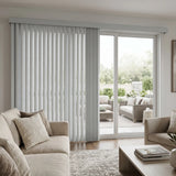 Creamy (Turnberry Washed Grey) 3 1/2 Inch S Shape Pvc Vertical Blinds providing a structured touch to a cozy living room, delivering a drapery-like aesthetic with easy-to-clean functionality.