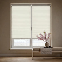 Load image into Gallery viewer, Styling a cozy living room with Creamy White (Daylight) 3 8 Inch Budget Single Cell Light Filtering Cordless Shades, providing excellent UV protection and a soft ambient light.
