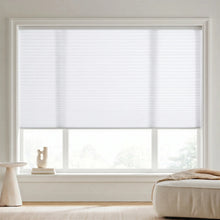 Load image into Gallery viewer, Custom window treatments: Creamy White (White Dove) 7 16 Inch Double Cell Light Filtering Shades shown in a bright living space, reducing screen glare while welcoming natural sunshine.
