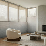 Creamy White (Dove Grey) 5 8 Daynight Single Cell Cellular Cordless Shades installed in a elegant living room, adding a refined finishing touch to the interior.