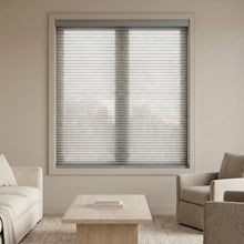 Load image into Gallery viewer, Interior view of a modern living space styled with Creamy White (Gray Sheen) 9 16 Classic Single Cell Light Filtering Cordless Shades, filtering out harsh glare to create an inviting atmosphere.
