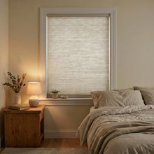 Load image into Gallery viewer, Creamy White (Greige) 3 8 Inch Budget Double Cell Light Filtering Cordless Shades installed in a modern bedroom, beautifully diffusing natural sunlight.
