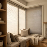 Sunlight hits the Creamy White (Greige) 3 8 Inch Budget Single Cell Light Filtering Cordless Shades in this cozy living space, reducing screen glare while welcoming natural sunshine.