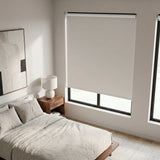 Modern Fabric Blackout Roller Shades add a touch of creamy elegance to this serene bedroom retreat, blocking out unwanted light and promoting peaceful rest.